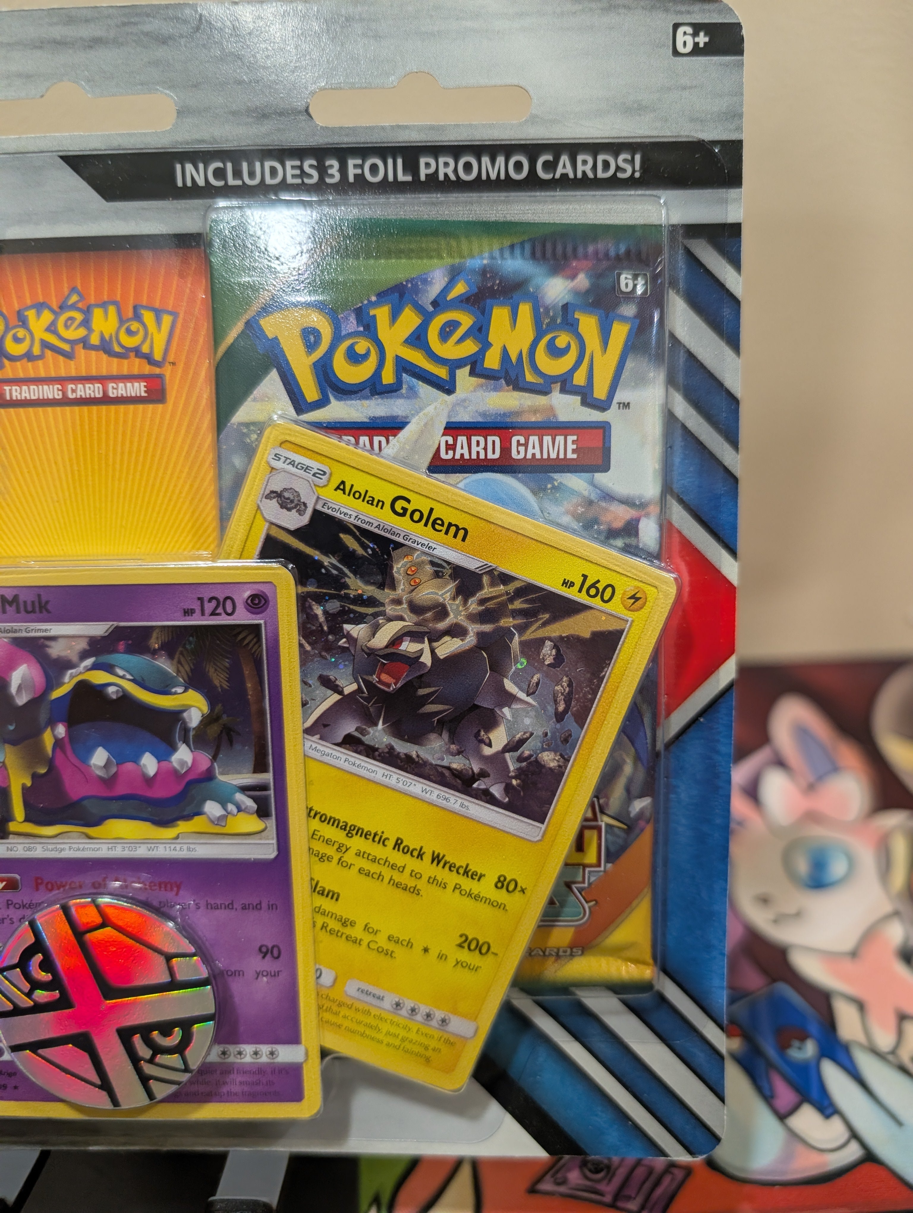 Pokémon TCG: 2 Booster Packs, Coin & Alolan Muk, Alolan Dugtrio & Alolan Golem Promo Cards