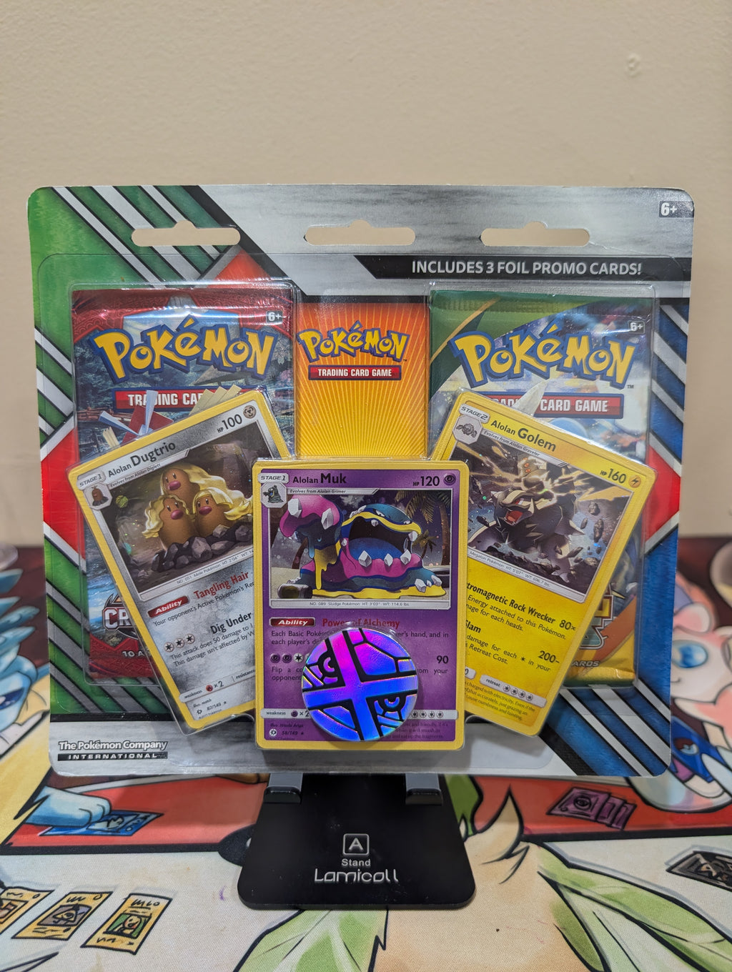 Pokémon TCG: 2 Booster Packs, Coin & Alolan Muk, Alolan Dugtrio & Alolan Golem Promo Cards
