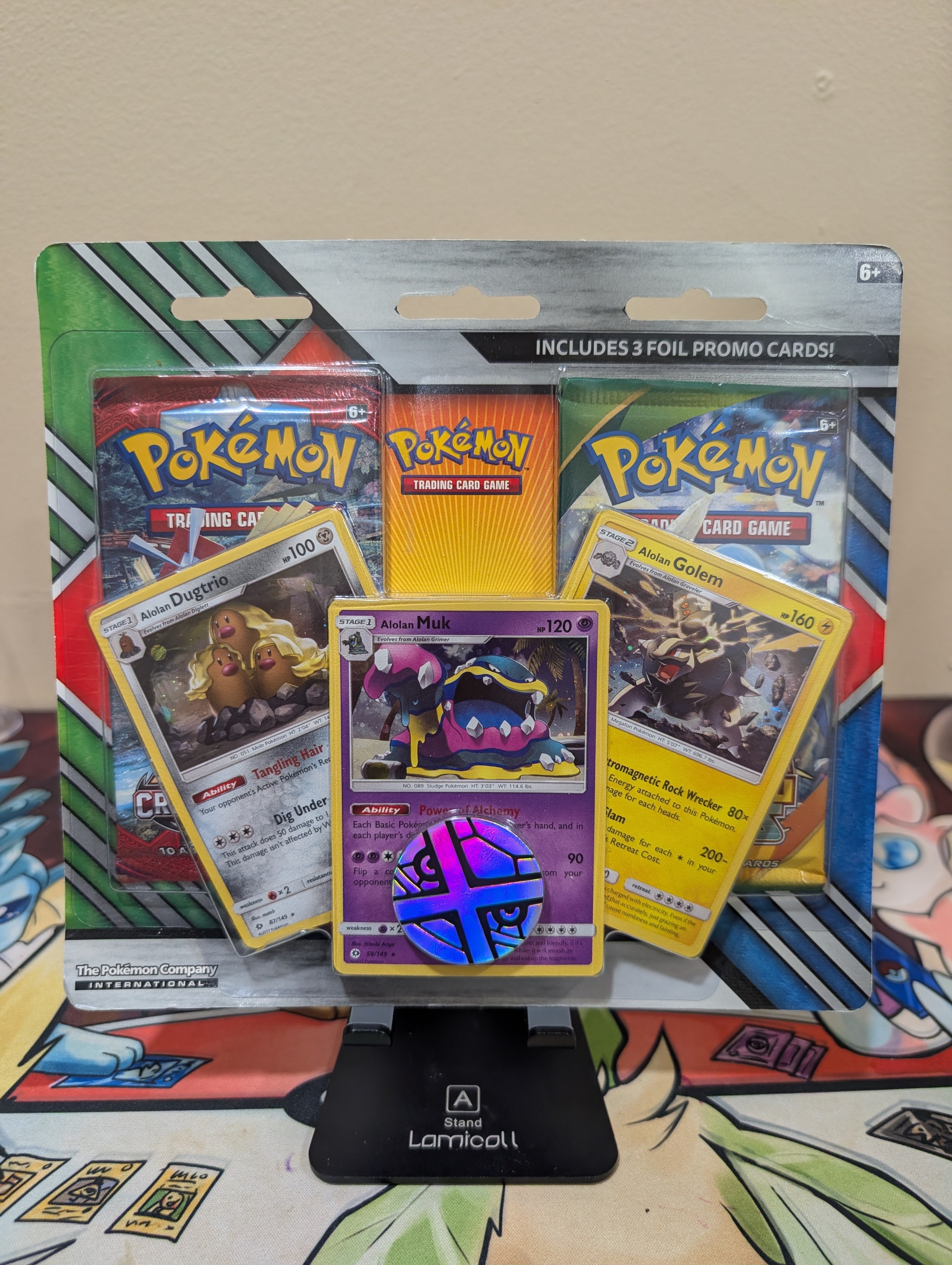 Pokémon TCG: 2 Booster Packs, Coin & Alolan Muk, Alolan Dugtrio & Alolan Golem Promo Cards