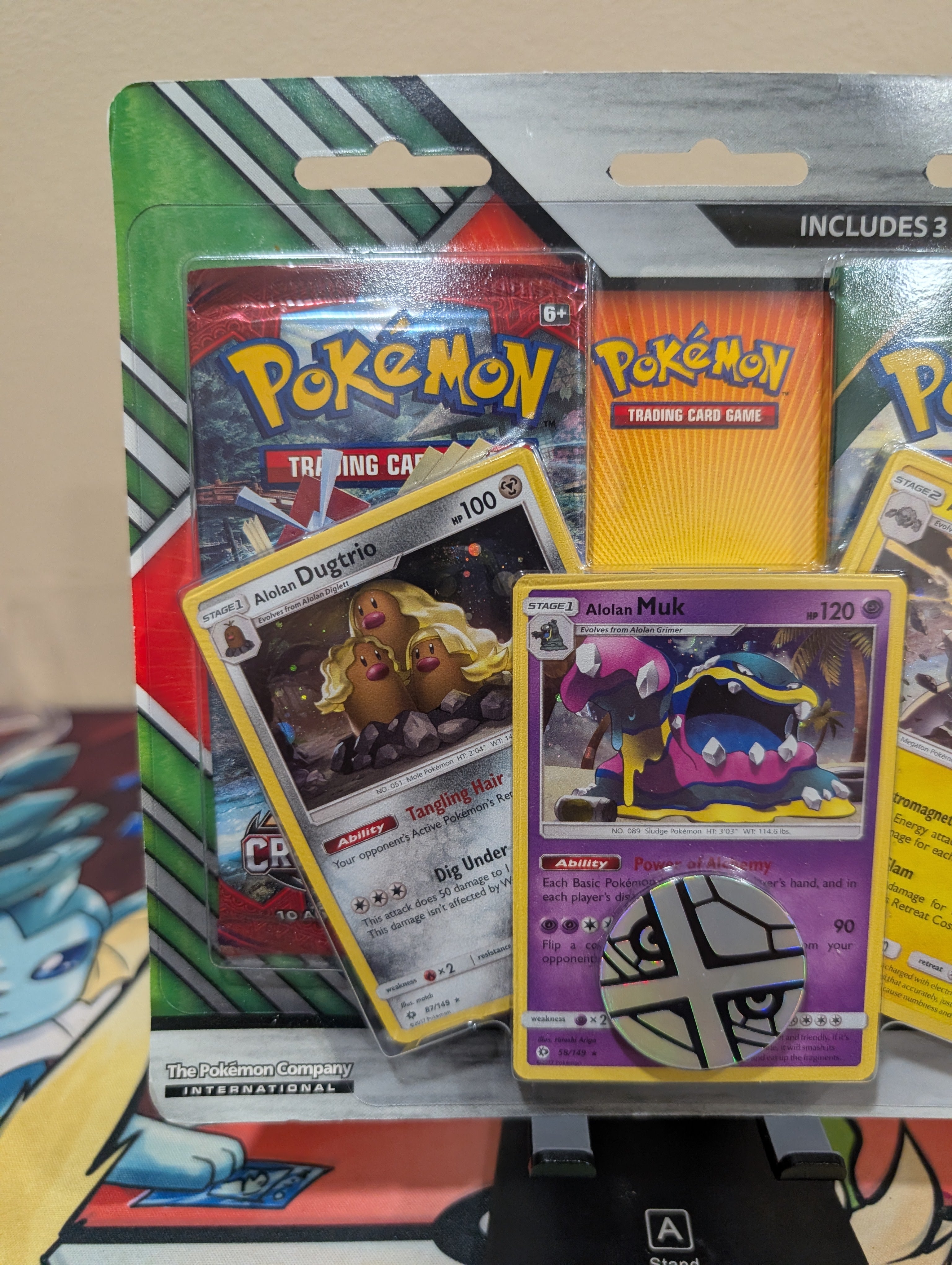 Pokémon TCG: 2 Booster Packs, Coin & Alolan Muk, Alolan Dugtrio & Alolan Golem Promo Cards
